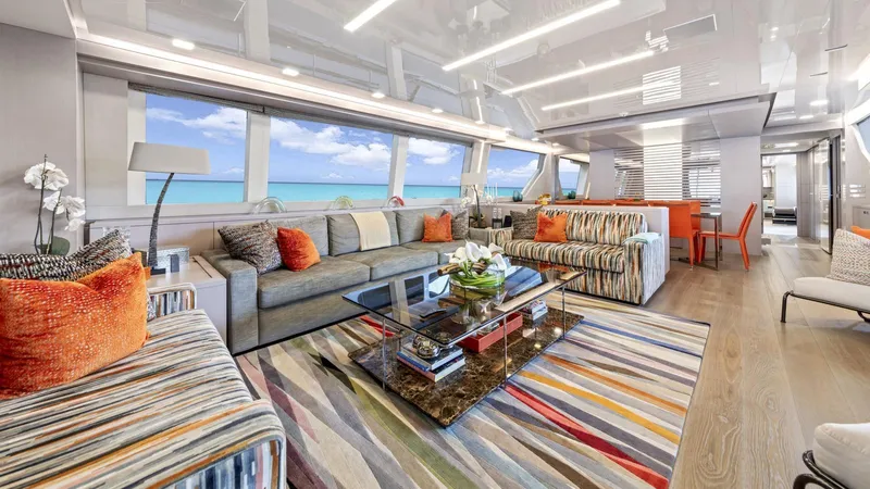 Chitochi Yacht Photos Pics Luxurious yacht interior with colorful decor, large windows, and ocean view, Custom Line Ferretti Group 2016.