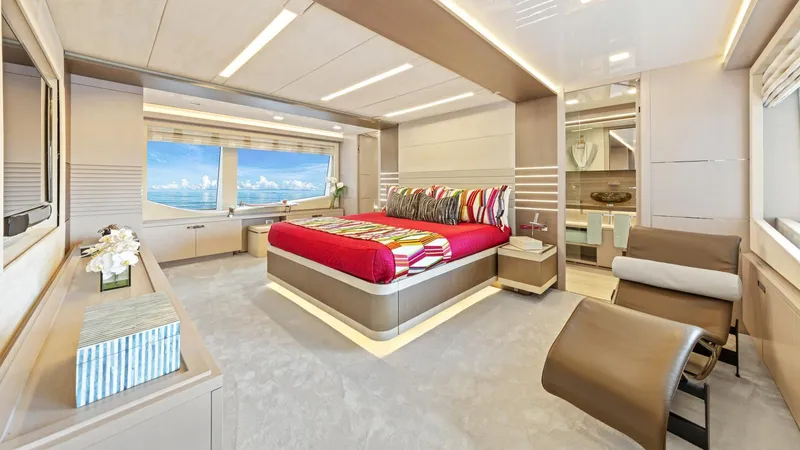 Chitochi Yacht Photos Pics Luxurious yacht bedroom with modern design, large window, and vibrant bedding, Custom Line Ferretti Group 2016.