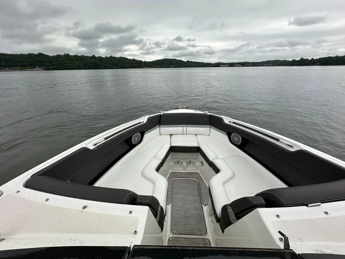  Yacht Photos Pics 2017 Sea Ray SLX 280 boat interior with lake view, featuring sleek seating and overcast sky.