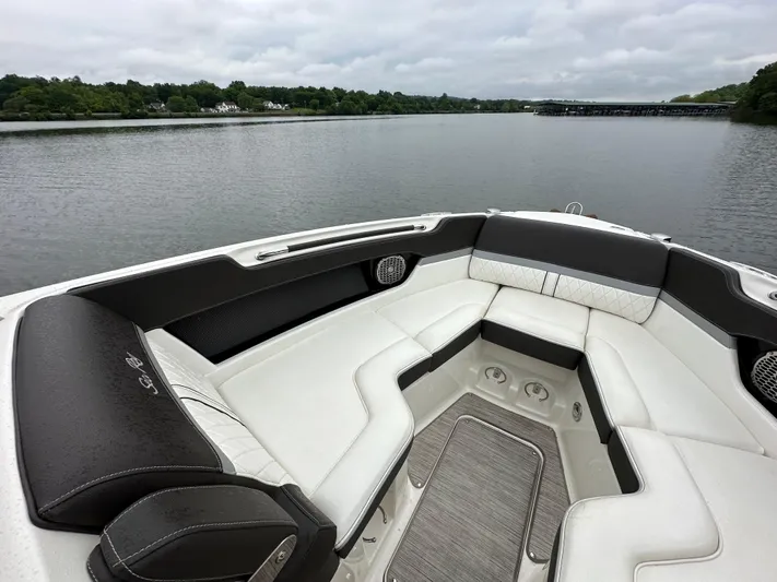  Yacht Photos Pics 2017 Sea Ray SLX 280 boat interior with luxurious seating on a calm lake.