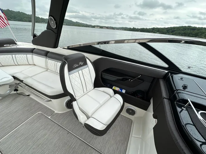  Yacht Photos Pics 2017 Sea Ray SLX 280 boat interior with white seating, on a calm lake.