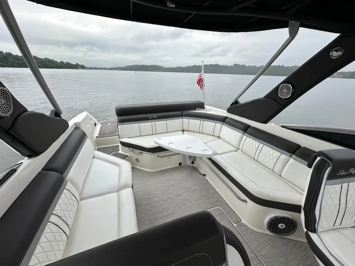  Yacht Photos Pics Luxurious 2017 Sea Ray SLX 280 boat interior with spacious seating on a calm lake.