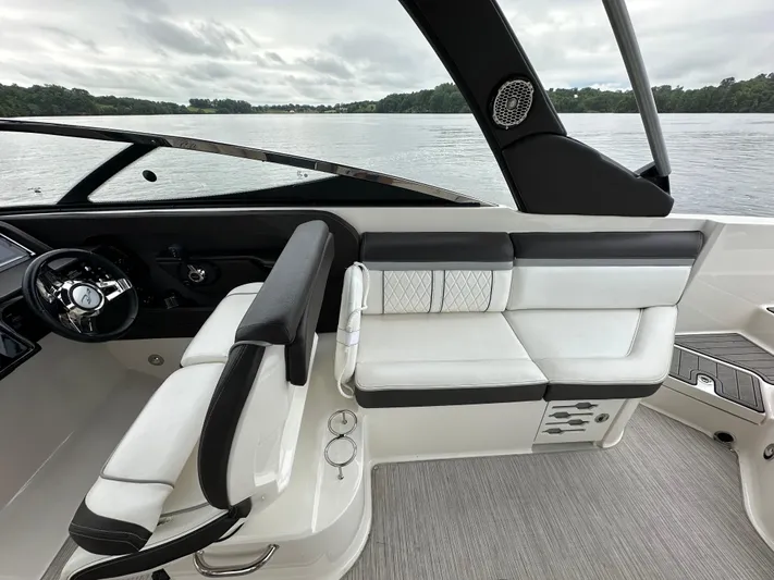  Yacht Photos Pics 2017 Sea Ray SLX 280 boat interior with sleek seating and modern design on a calm lake.