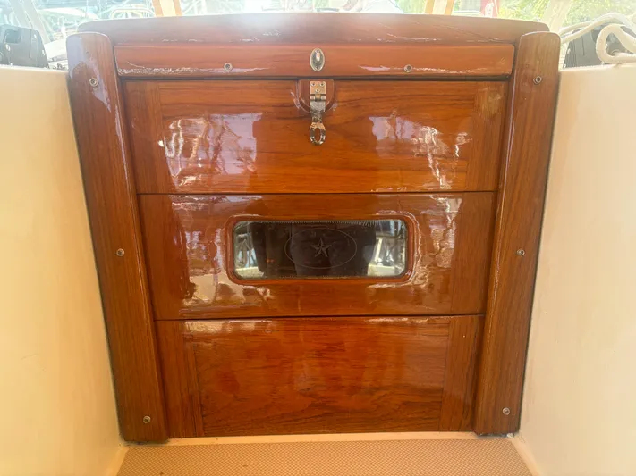 Island Girl Yacht Photos Pics Polished wooden hatch of a 1990 Island Packet 38 sailboat.