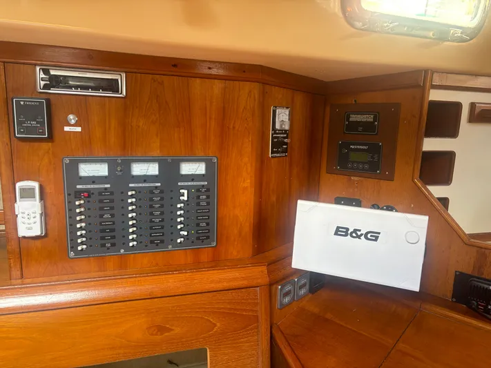 Island Girl Yacht Photos Pics Control panel of a 1990 Island Packet 38 sailboat with navigation equipment.