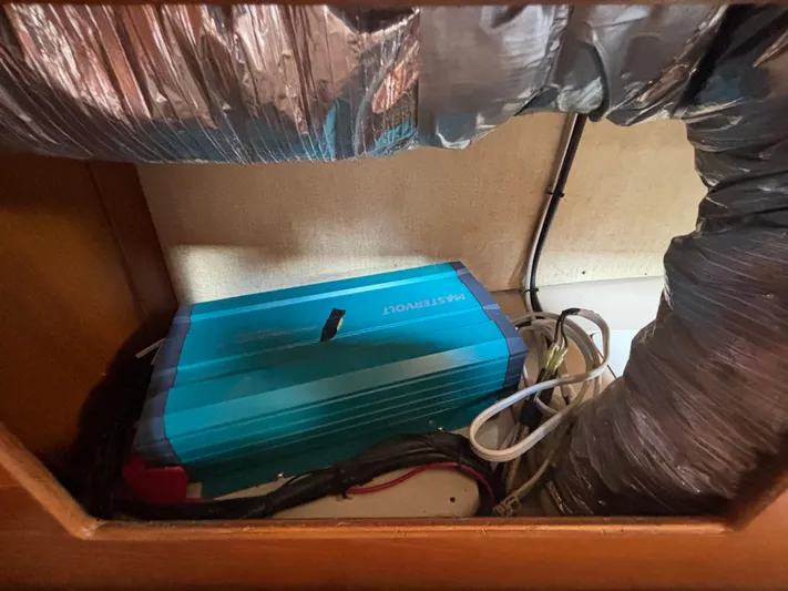 Island Girl Yacht Photos Pics Electrical equipment inside a 1990 Island Packet 38 sailboat, featuring wiring and ductwork.