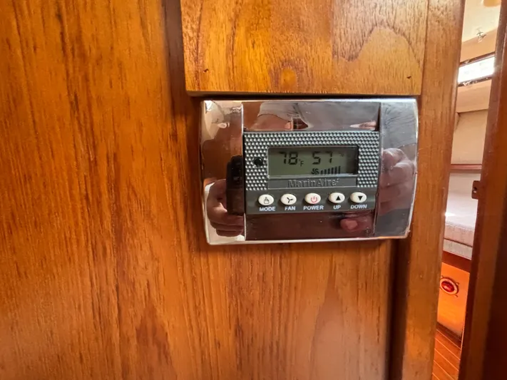 Island Girl Yacht Photos Pics Thermostat on 1990 Island Packet 38 yacht, mounted on wooden panel.