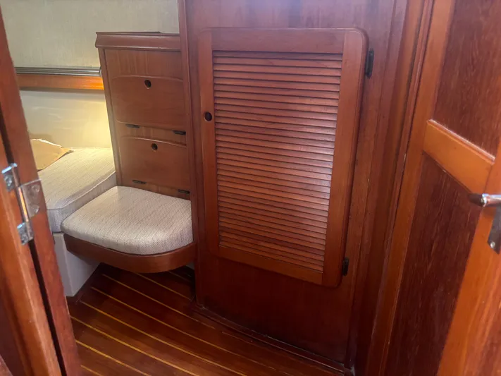 Island Girl Yacht Photos Pics Interior of 1990 Island Packet 38 sailboat with wooden cabinetry and cozy seating.
