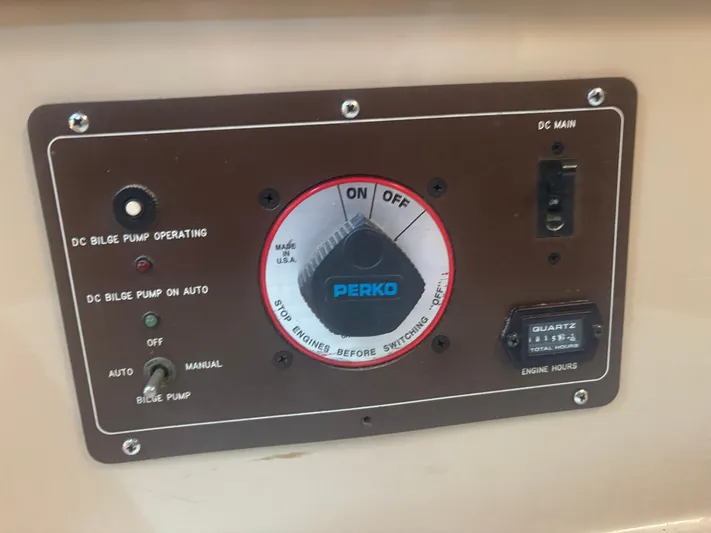 Island Girl Yacht Photos Pics Control panel of a 1990 Island Packet 38 sailboat with bilge pump and engine hour meter.