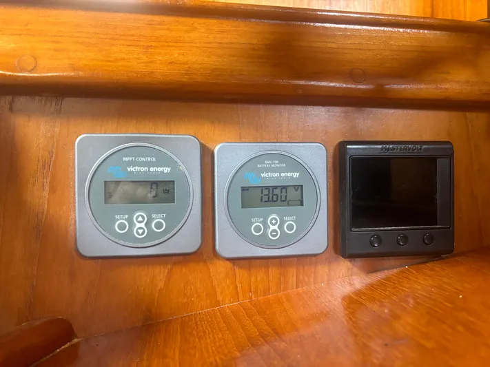 Island Girl Yacht Photos Pics Digital displays on a 1990 Island Packet 38 boat, featuring Victron Energy monitors.