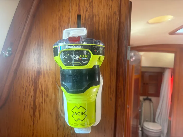 Island Girl Yacht Photos Pics EPIRB device mounted on a 1990 Island Packet 38 sailboat interior.