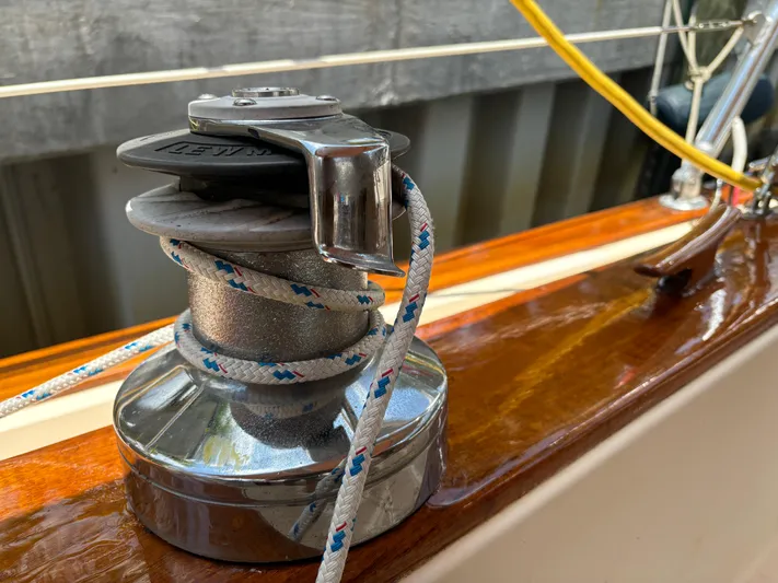 Island Girl Yacht Photos Pics Winch on 1990 Island Packet 38 sailboat with rope, polished wood deck.