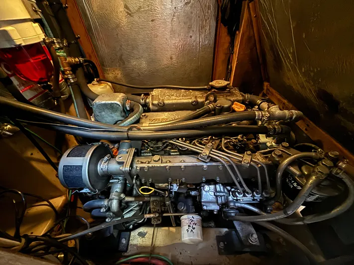 Island Girl Yacht Photos Pics Engine compartment of a 1990 Island Packet 38 sailboat, showcasing detailed mechanical components.