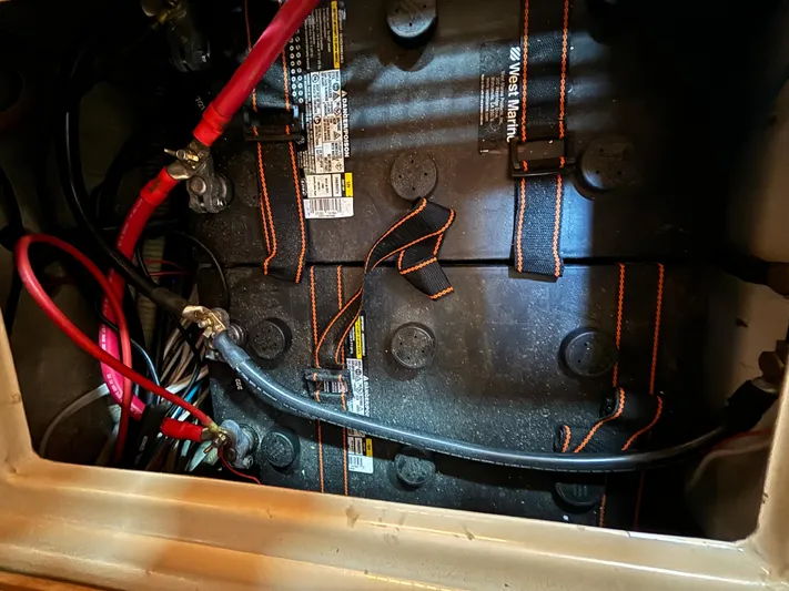 Island Girl Yacht Photos Pics Battery compartment of a 1990 Island Packet 38 sailboat with visible wiring connections.