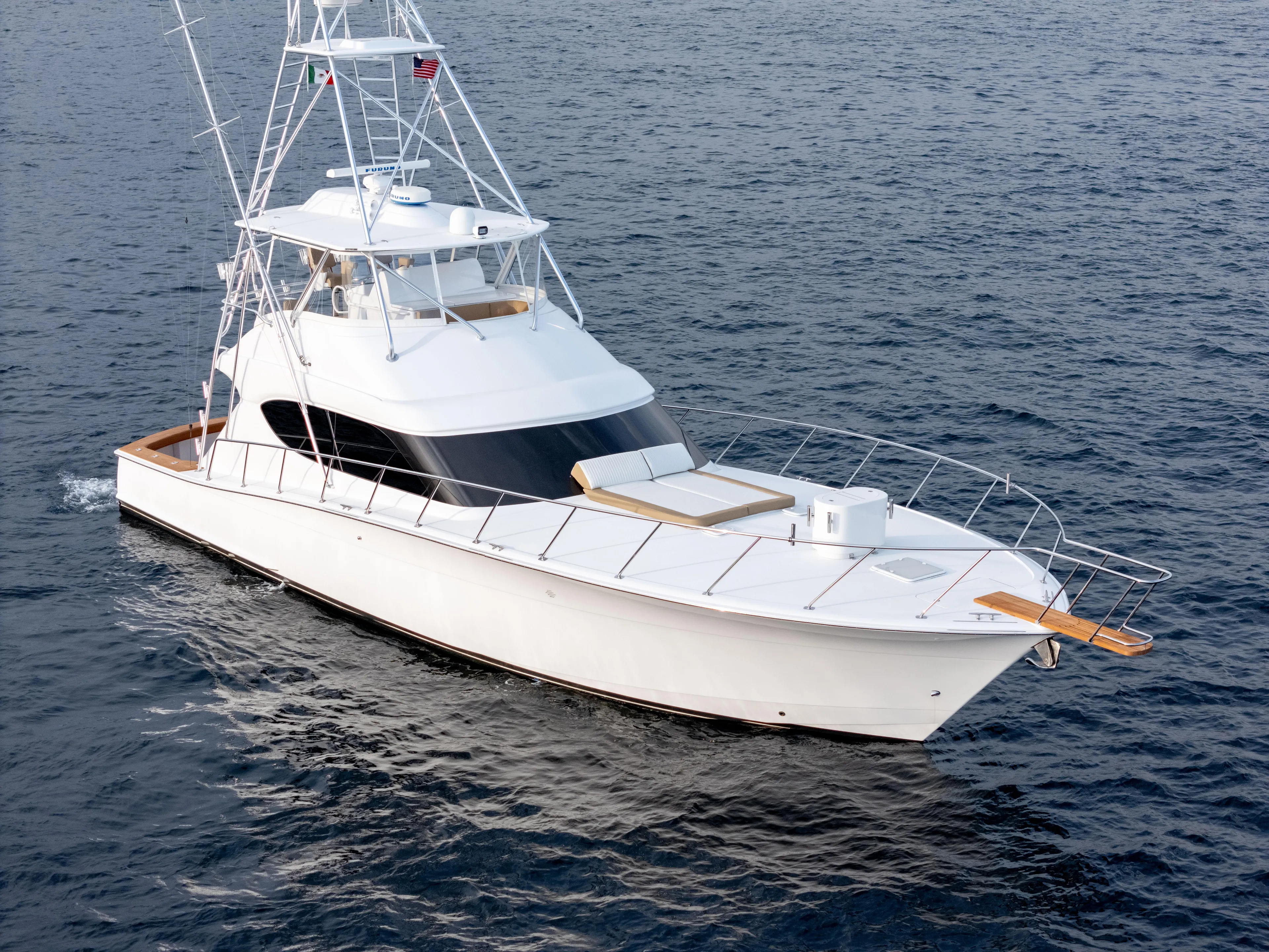 Baja Vida Yacht Photos Pics 2010 Hatteras 60 Convertible yacht cruising on open water.