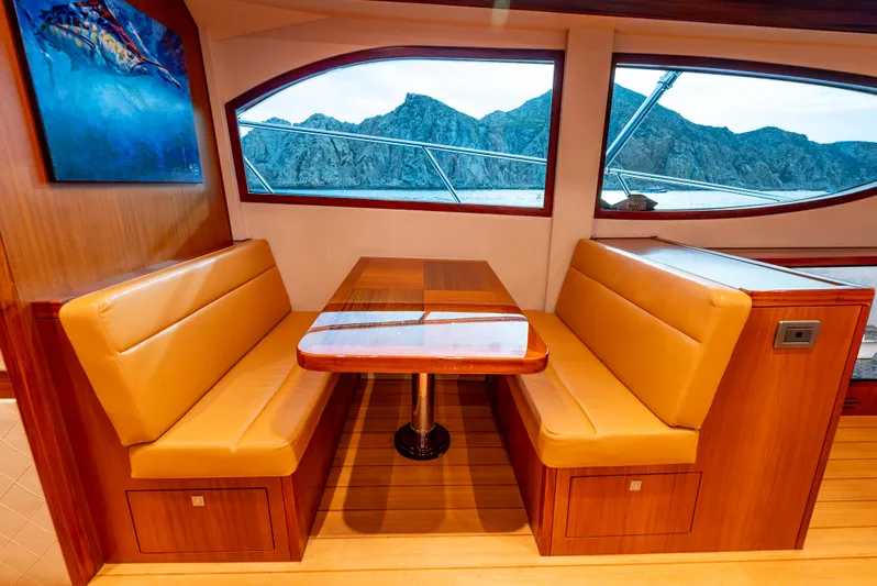 Baja Vida Yacht Photos Pics Luxurious interior of 2010 Hatteras 60 Convertible yacht with scenic window view.