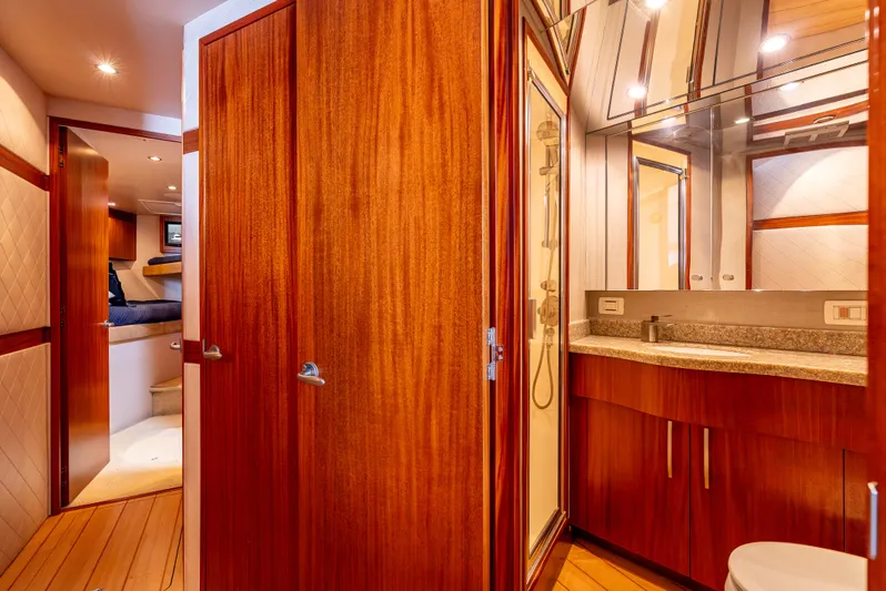 Baja Vida Yacht Photos Pics Luxurious bathroom interior on 2010 Hatteras 60 Convertible yacht with wood finishes.