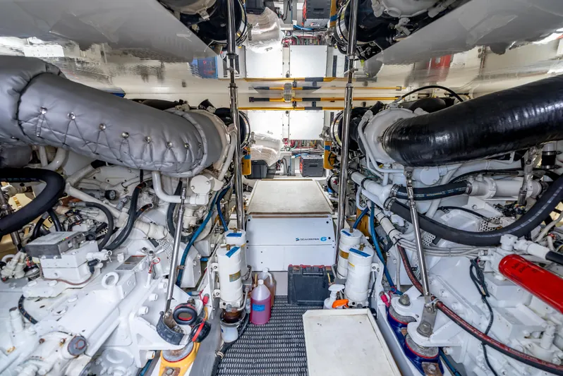 Baja Vida Yacht Photos Pics Engine room of 2010 Hatteras 60 Convertible yacht, showcasing dual engines and mechanical systems.