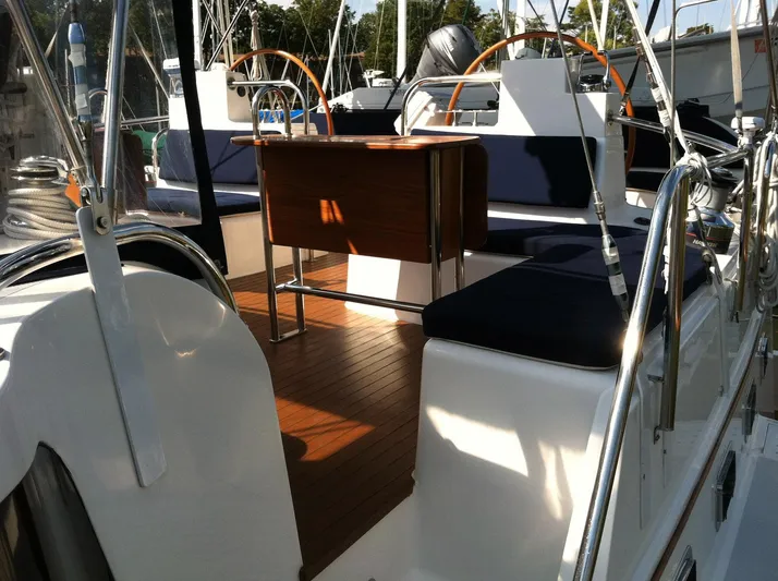 The Harlen Wood Yacht Photos Pics Cockpit of 2010 Shannon 53 HPS yacht with wooden flooring and seating.