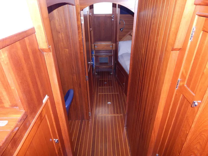 The Harlen Wood Yacht Photos Pics Interior of 2010 Shannon 53 HPS yacht with wooden paneling and flooring.