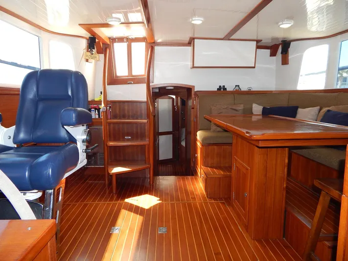 The Harlen Wood Yacht Photos Pics Luxurious interior of 2010 Shannon 53 HPS yacht with wooden flooring and seating.
