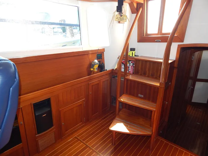 The Harlen Wood Yacht Photos Pics Interior of 2010 Shannon 53 HPS yacht with wooden stairs and cabinetry.