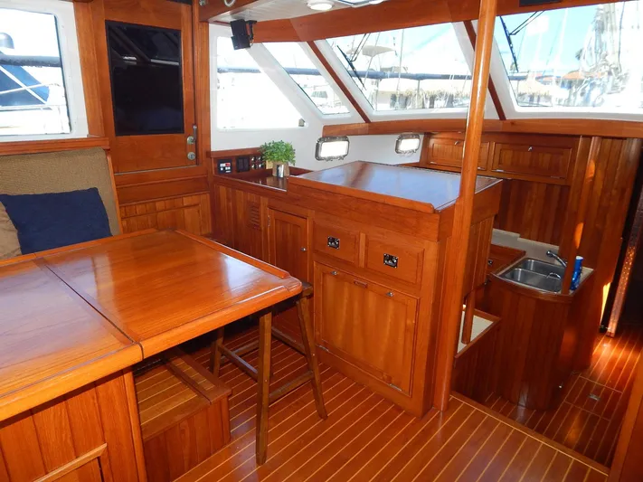 The Harlen Wood Yacht Photos Pics Luxurious interior of 2010 Shannon 53 HPS yacht with wooden furnishings and modern amenities.