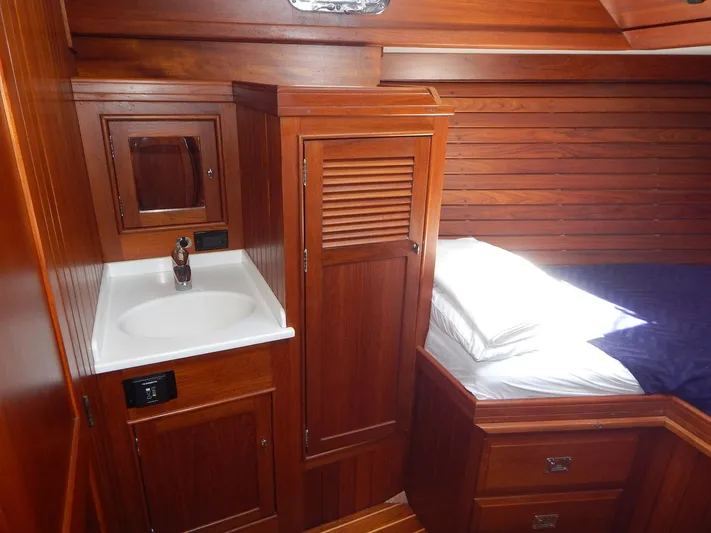 The Harlen Wood Yacht Photos Pics Luxurious wooden interior of 2010 Shannon 53 HPS yacht with sink and bed.