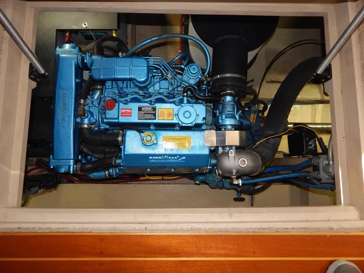 The Harlen Wood Yacht Photos Pics Engine compartment of a 2010 Shannon 53 HPS, showcasing a blue marine engine.