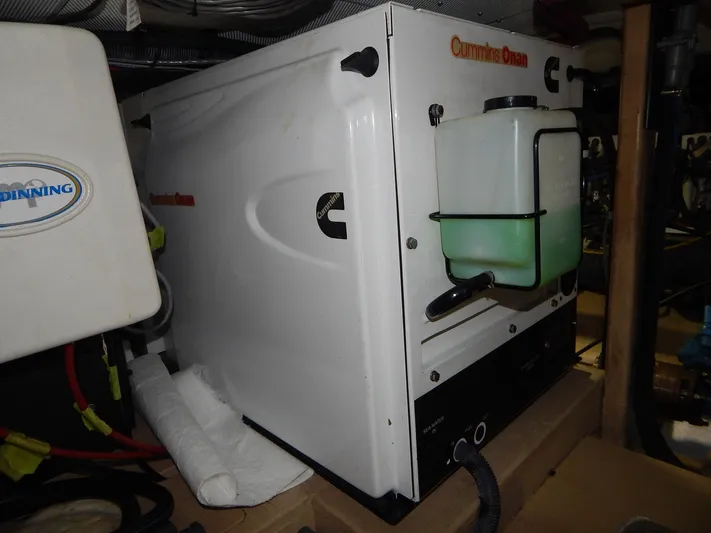 The Harlen Wood Yacht Photos Pics Cummins Onan generator in a Shannon 53 HPS, 2010 model, with attached fluid container.