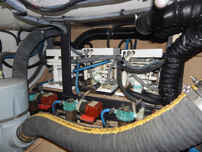 The Harlen Wood Yacht Photos Pics Engine room of 2010 Shannon 53 HPS with complex piping and machinery.