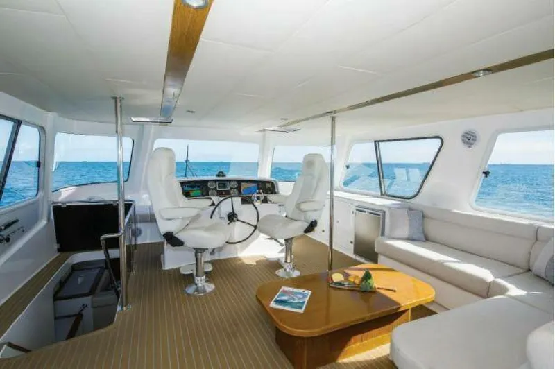 Albatross Yacht Photos Pics Luxurious 2014 PowerPlay Catamarans Power Cat interior with ocean view and modern seating.