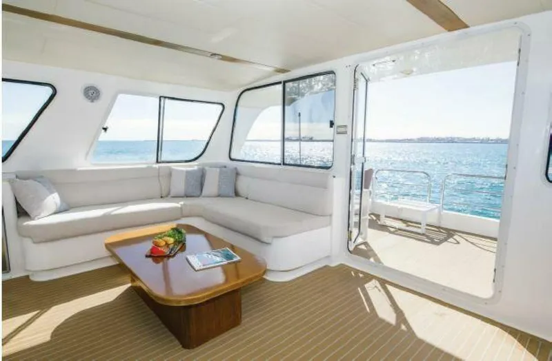 Albatross Yacht Photos Pics Luxurious 2014 PowerPlay Catamarans Power Cat interior with ocean view and comfortable seating.