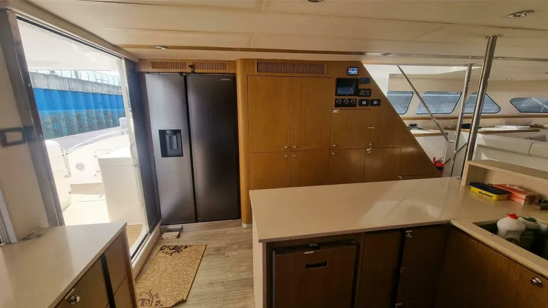 Albatross Yacht Photos Pics Interior of 2014 PowerPlay Catamarans Power Cat, featuring modern kitchen and sleek design.