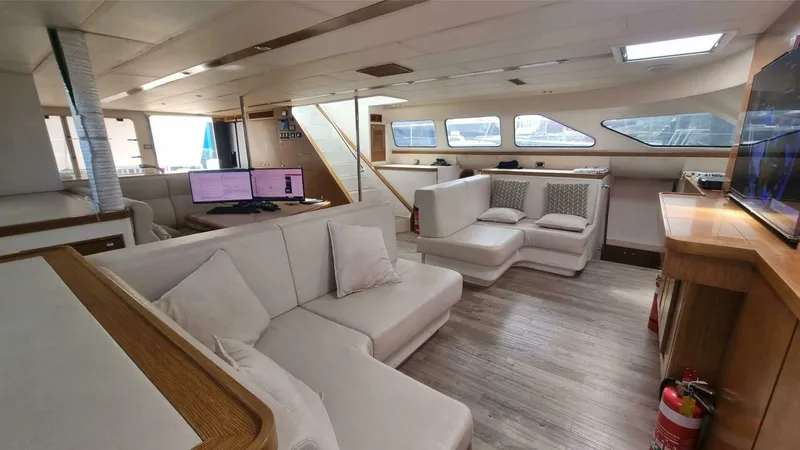 Albatross Yacht Photos Pics Luxurious 2014 PowerPlay Catamarans Power Cat interior with modern seating and spacious layout.