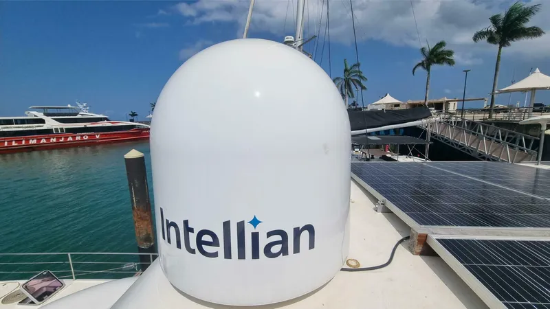 Albatross Yacht Photos Pics Intellian satellite dome on 2014 PowerPlay Catamarans Power Cat, docked with solar panels.