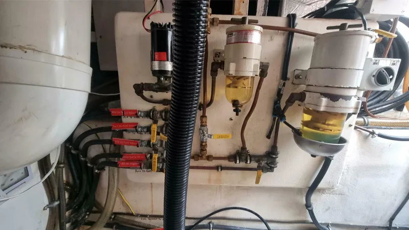 Albatross Yacht Photos Pics Engine room of 2014 PowerPlay Catamarans Power Cat, featuring fuel filters and hoses.