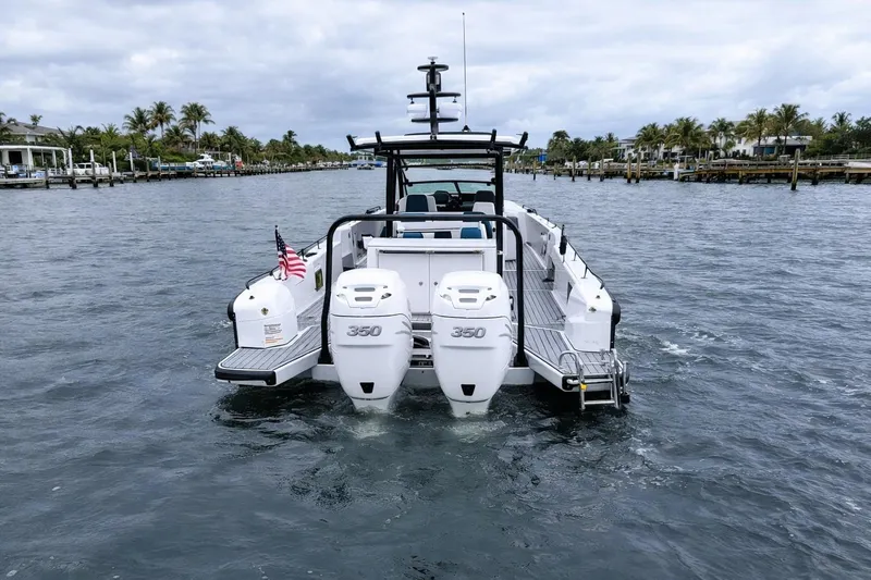  Yacht Photos Pics 2022 Axopar 37 Sun-Top boat with twin 350 engines on a scenic waterway.