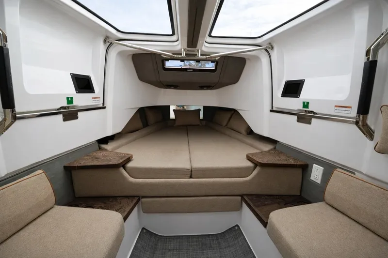  Yacht Photos Pics Interior cabin of 2022 Axopar 37 Sun-Top boat with beige seating and modern design.