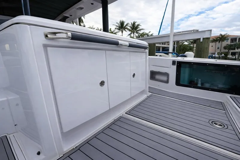  Yacht Photos Pics 2022 Axopar 37 Sun-Top boat deck with sleek storage compartments and modern design.