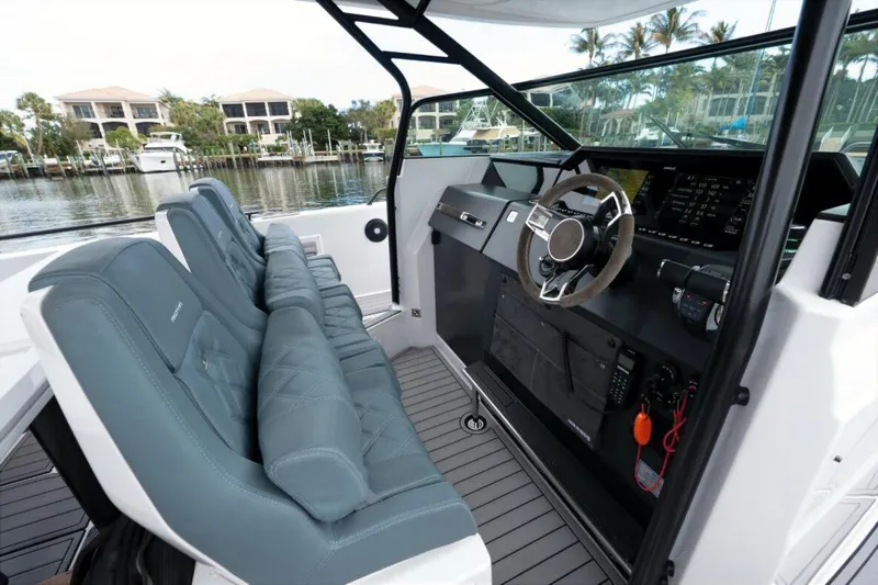  Yacht Photos Pics 2022 Axopar 37 Sun-Top boat interior with modern dashboard and seating.