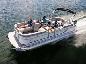2025 Godfrey Xperience 2286 SBX pontoon boat cruising on water with passengers.