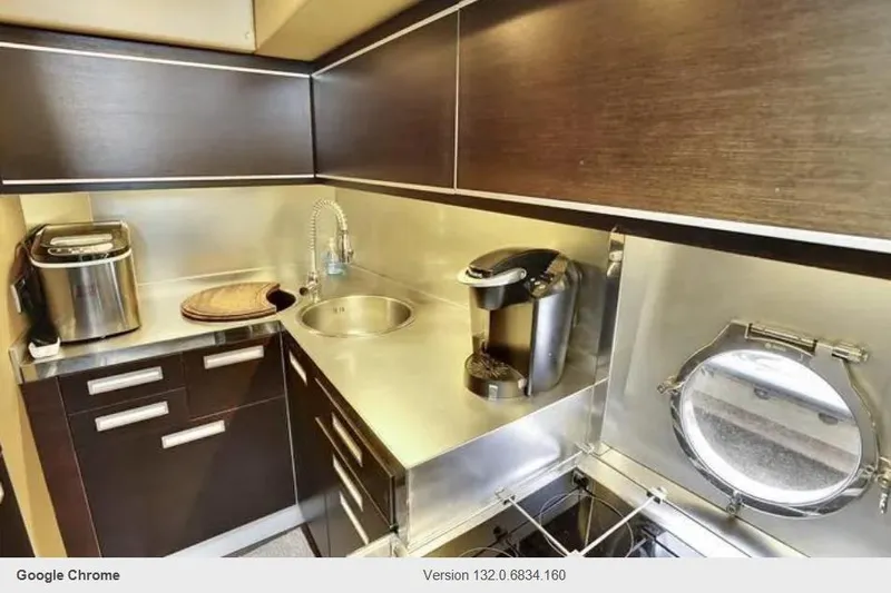 Victoria Yacht Photos Pics Luxurious kitchen in 2007 Azimut 68S yacht with modern appliances and sleek design.