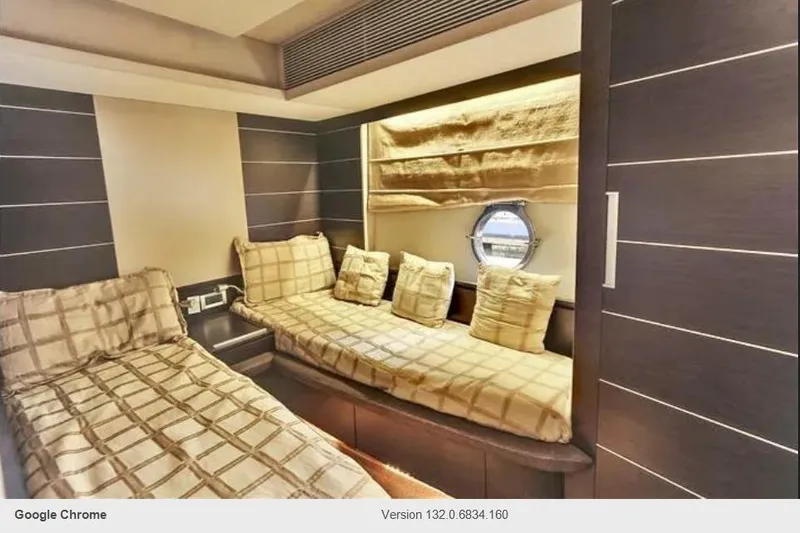 Victoria Yacht Photos Pics Luxurious 2007 Azimut 68S yacht cabin with twin beds and porthole window.