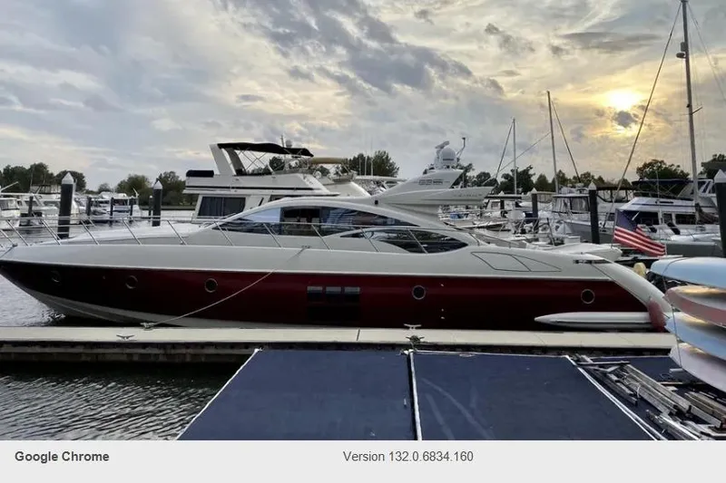Victoria Yacht Photos Pics 2007 Azimut 68S yacht docked at marina during sunset, surrounded by other boats.