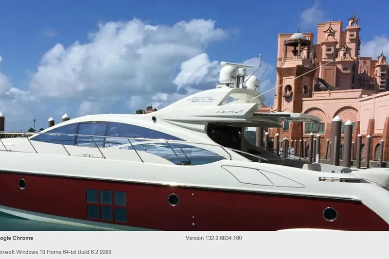 Victoria Yacht Photos Pics 2007 Azimut 68S yacht docked near ornate pink building under blue sky.