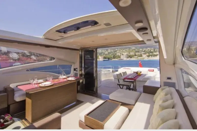 Victoria Yacht Photos Pics Luxurious interior of 2007 Azimut 68S yacht with elegant dining area and scenic ocean view.