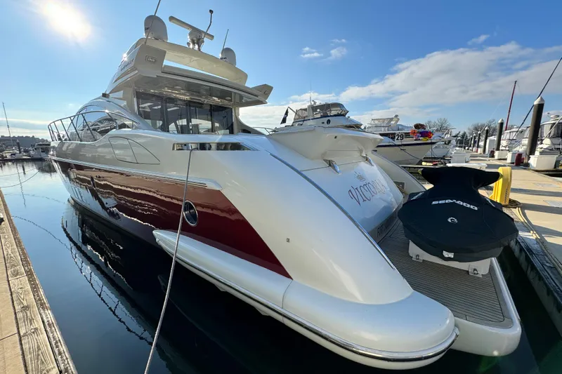 Victoria Yacht Photos Pics Luxury 2007 Azimut 68S yacht docked with Sea-Doo jet ski on platform.
