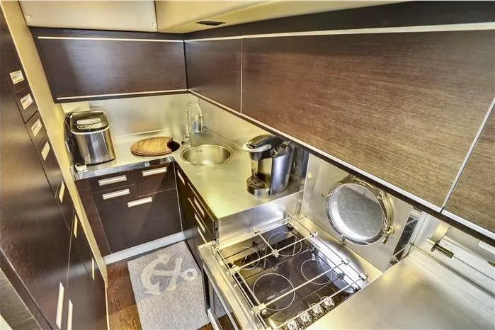 Victoria Yacht Photos Pics Luxurious kitchen in 2007 Azimut 68S yacht with modern appliances and sleek design.