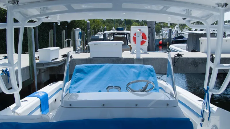 R&r Yacht Photos Pics 2017 Intrepid 400 Cuddy at dock, covered helm, marina background.